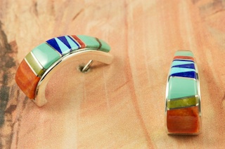 Genuine Sleeping Beauty Turquoise, Spiny Oyster Shell and Blue Lapis inlaid between ribbons of Sterling Silver. Beautiful Sterling Silver Post Earrings feature precision channel inlay. Designed by Navajo Artist Calvin Begay. Signed by the artist.
